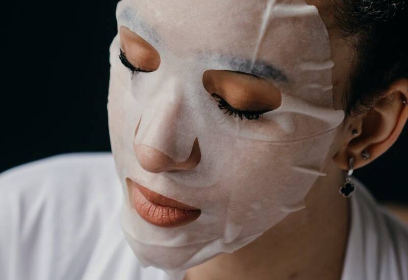 A woman using a face mask